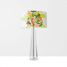 Load image into Gallery viewer, Geometric abstract orange floral drum lampshade on a clear table lamp, modern decor with vibrant colors.